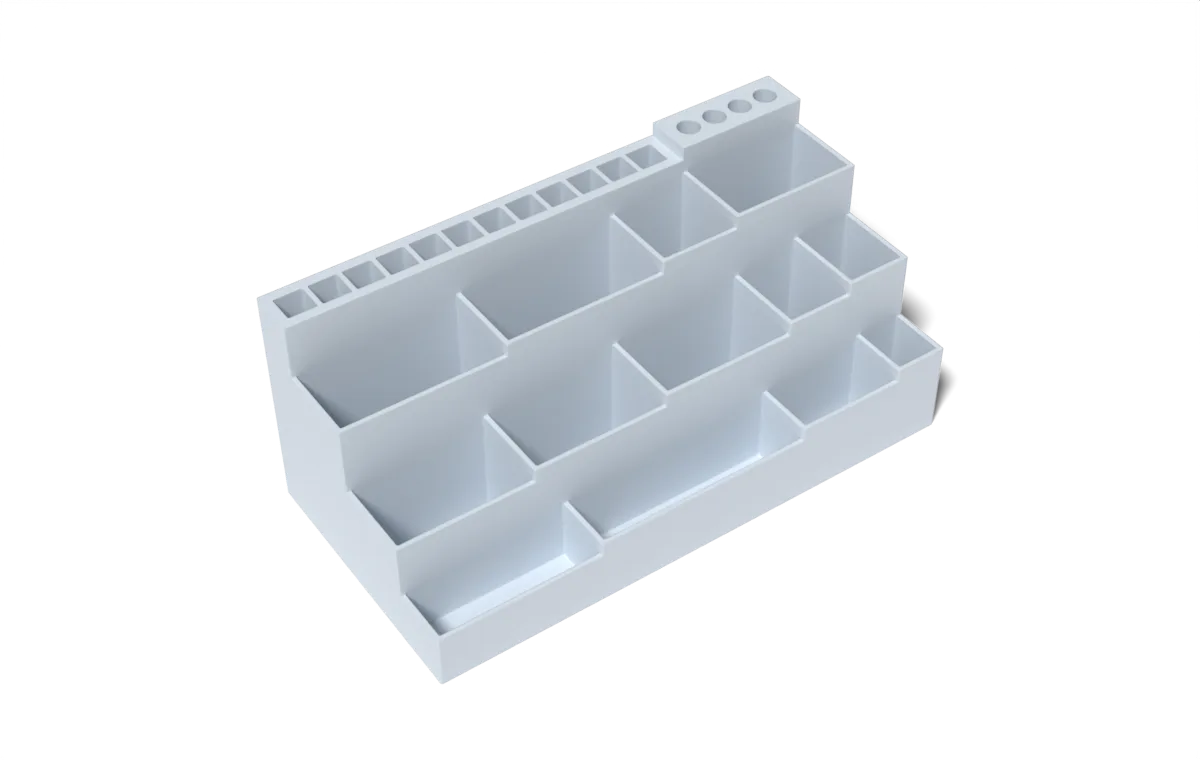 Rendered example: a 200 by 100mm fused desk tidy with 15 compartments stepping down in height, with square and round slots along the back